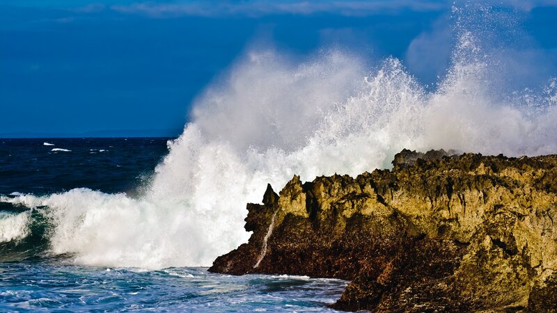 Waves crashing on rocky shore