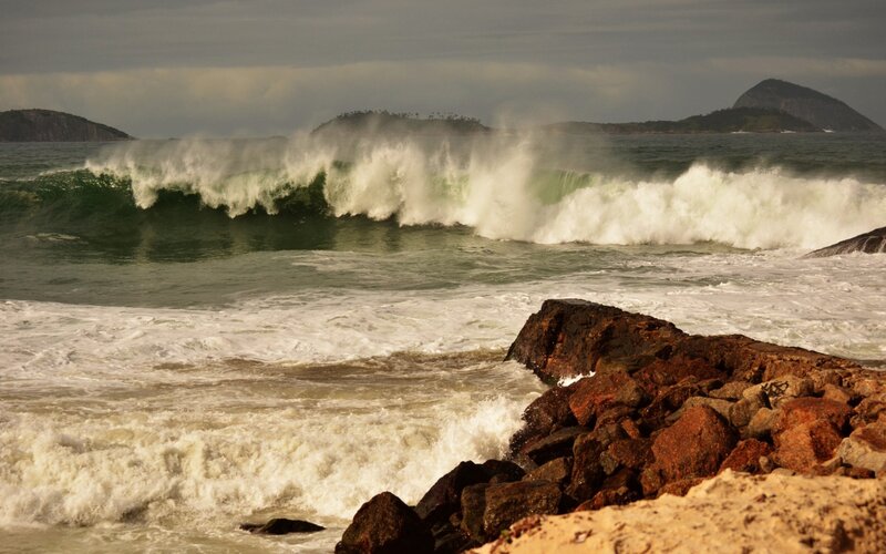 Waves crashing on rocky shore