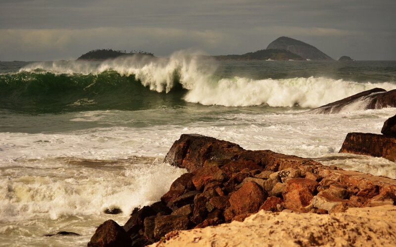 Waves crashing on rocky shore