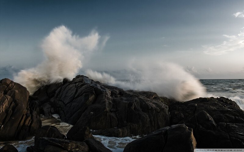 Waves crashing on rocky shore