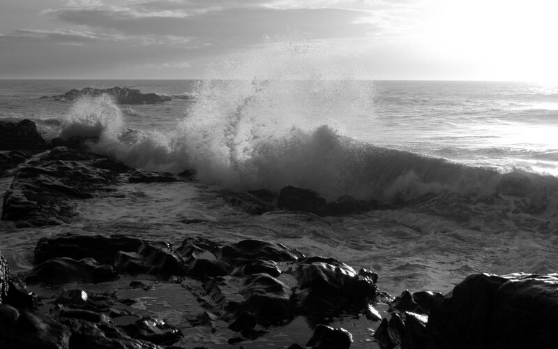 Waves crashing on rocky shore