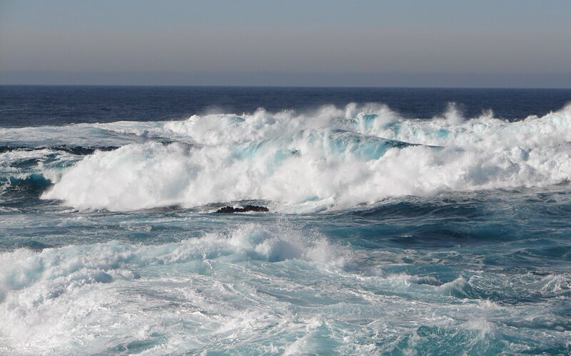 Waves crashing on rocky shore