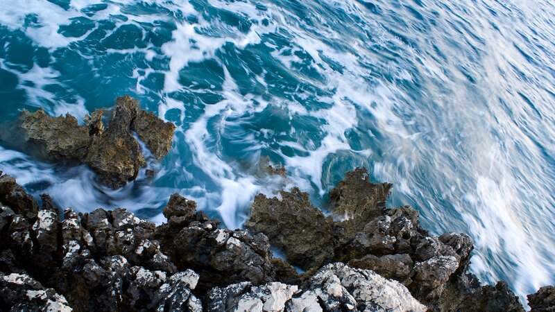 Waves crashing on rocky shore