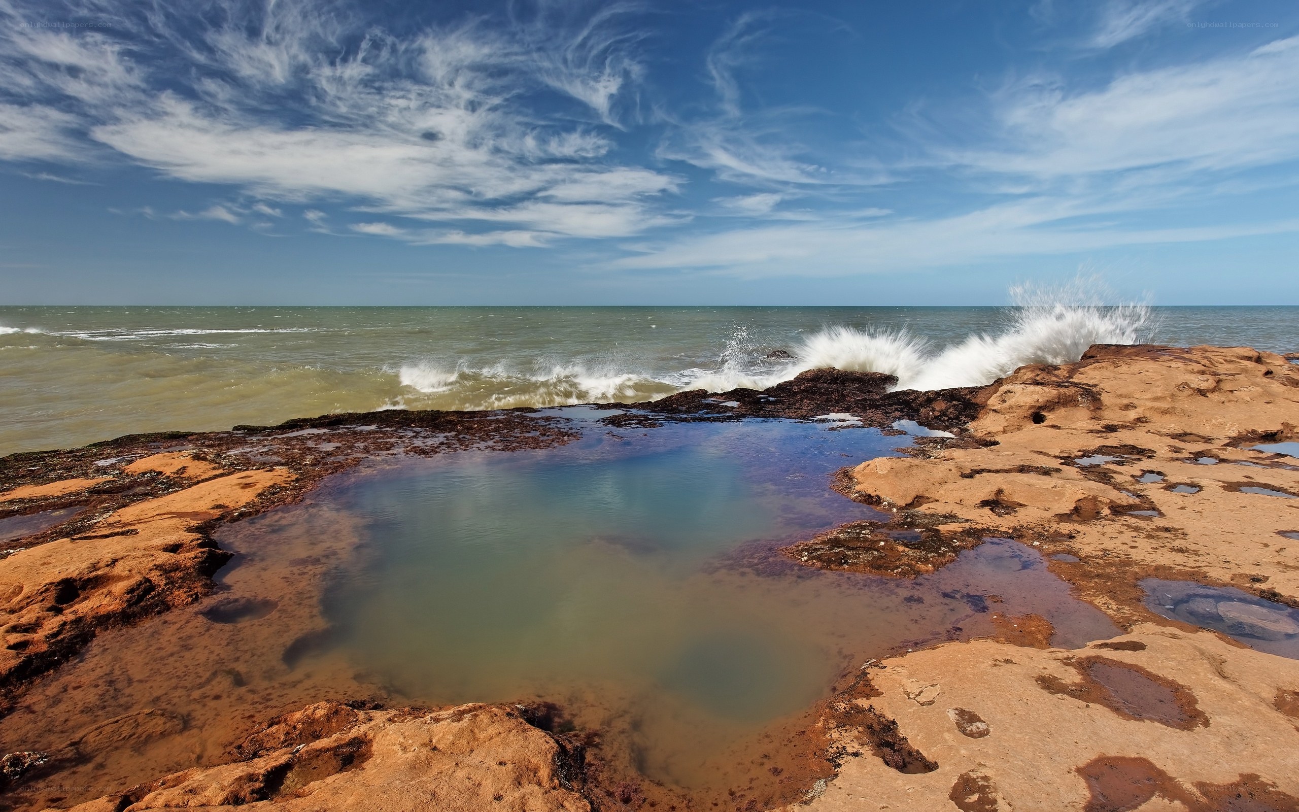 Waves crashing on rocky shore