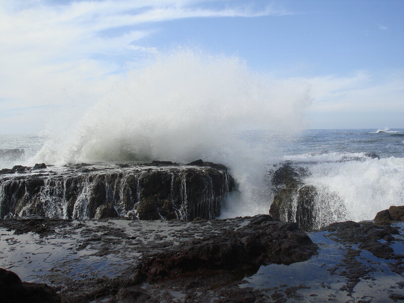 Waves crashing on rocky shore