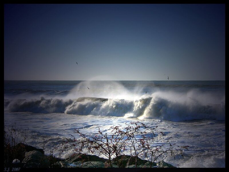 Waves crashing on rocky shore