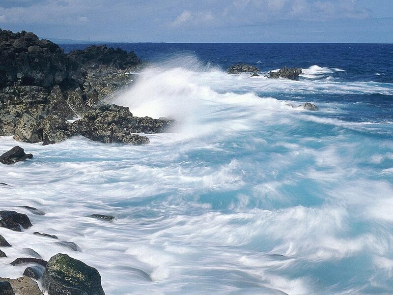 Waves crashing on rocky shore