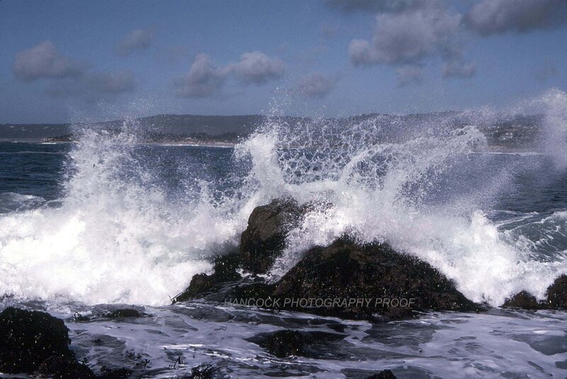 Waves crashing on rocky shore