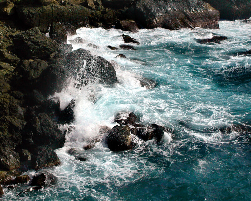 Waves crashing on rocky shore