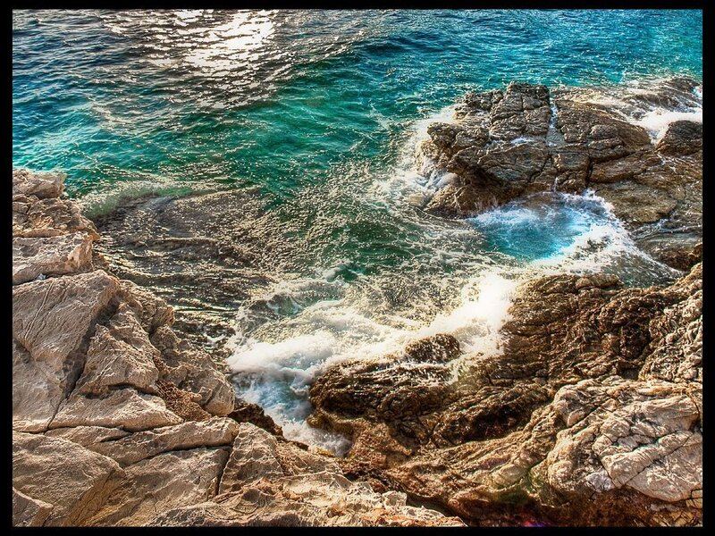 Waves crashing on rocky shore