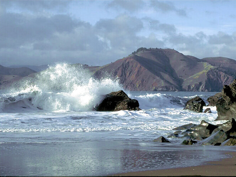 Waves crashing on rocky shore