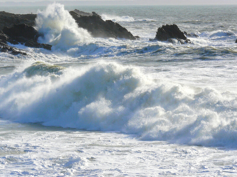 Waves crashing on rocky shore