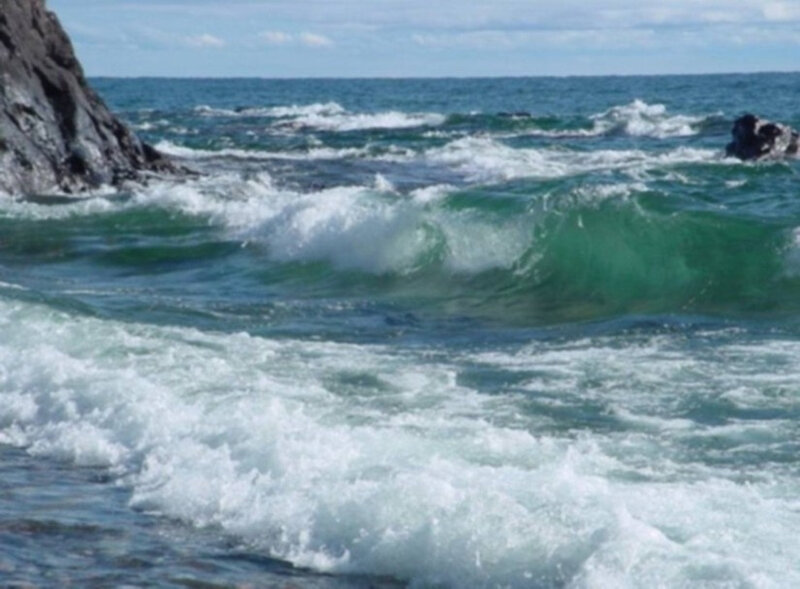 Waves crashing on rocky shore