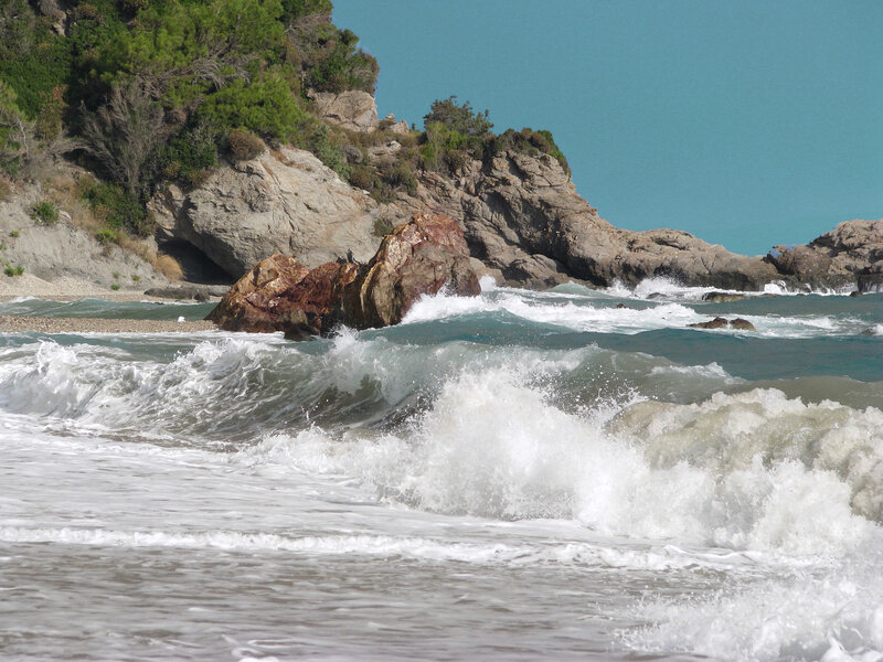 Waves crashing on rocky shore