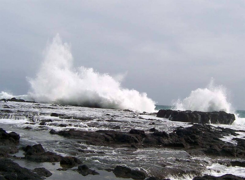 Waves crashing on rocky shore