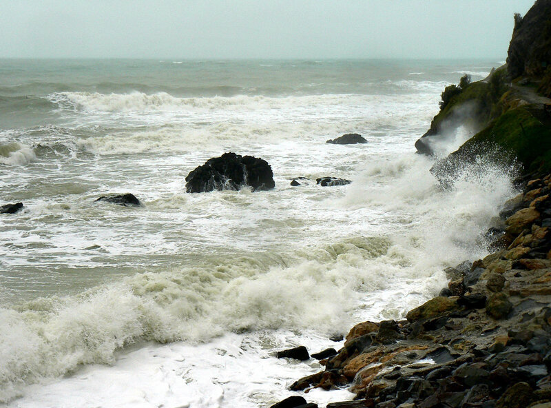 Waves crashing on rocky shore