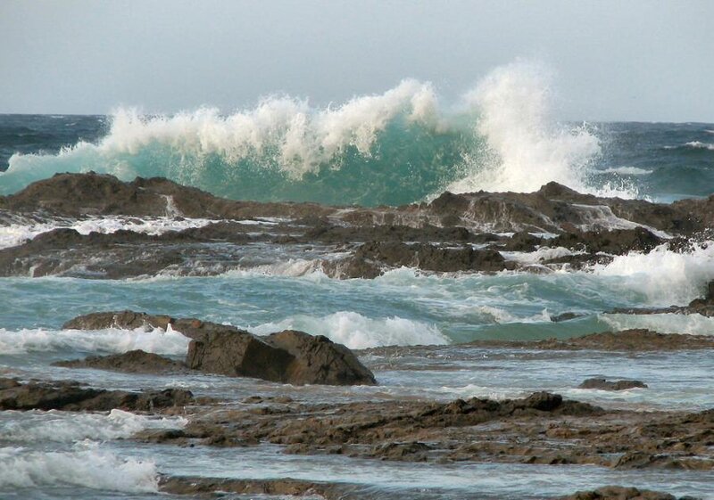 Waves crashing on rocky shore