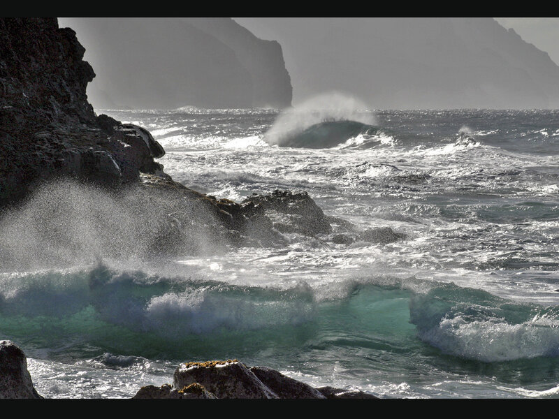 Waves crashing on rocky shore
