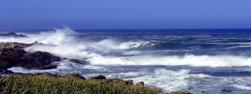 Waves crashing on rocky shore