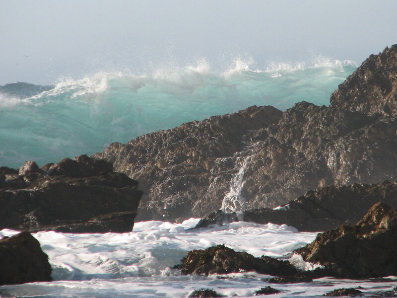 Waves crashing on rocky shore