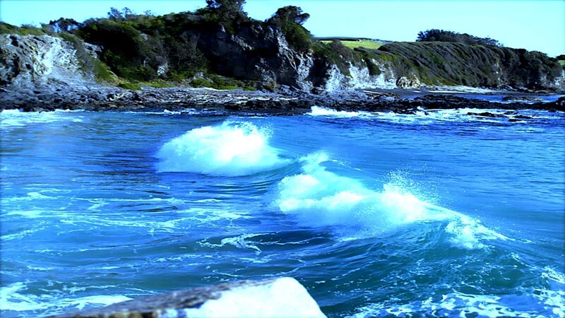 Waves crashing on rocky shore