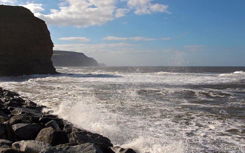 Waves crashing on rocky shore