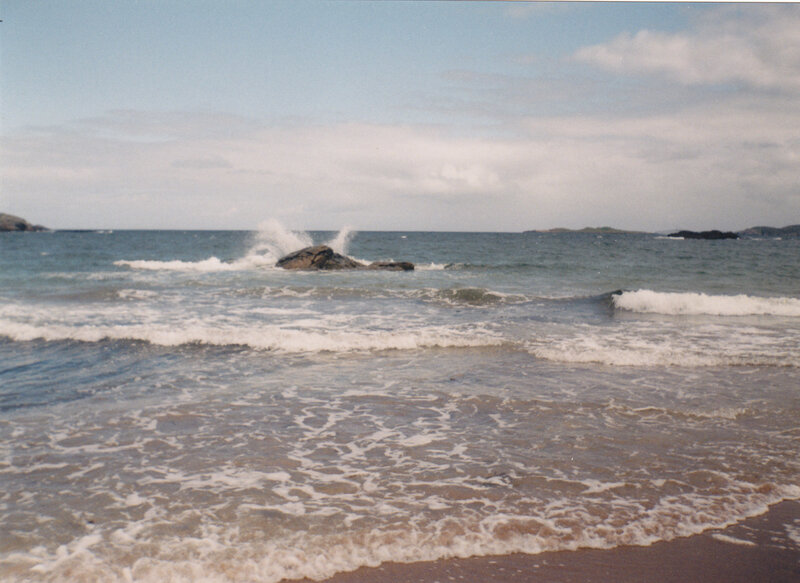 Waves crashing on rocky shore