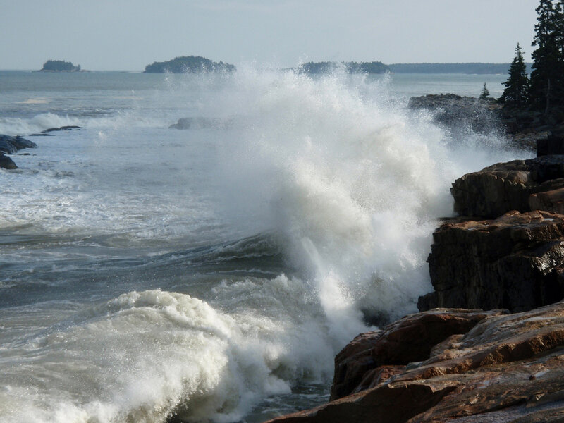 Waves crashing on rocky shore