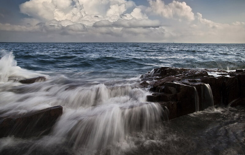 Waves crashing on rocky shore