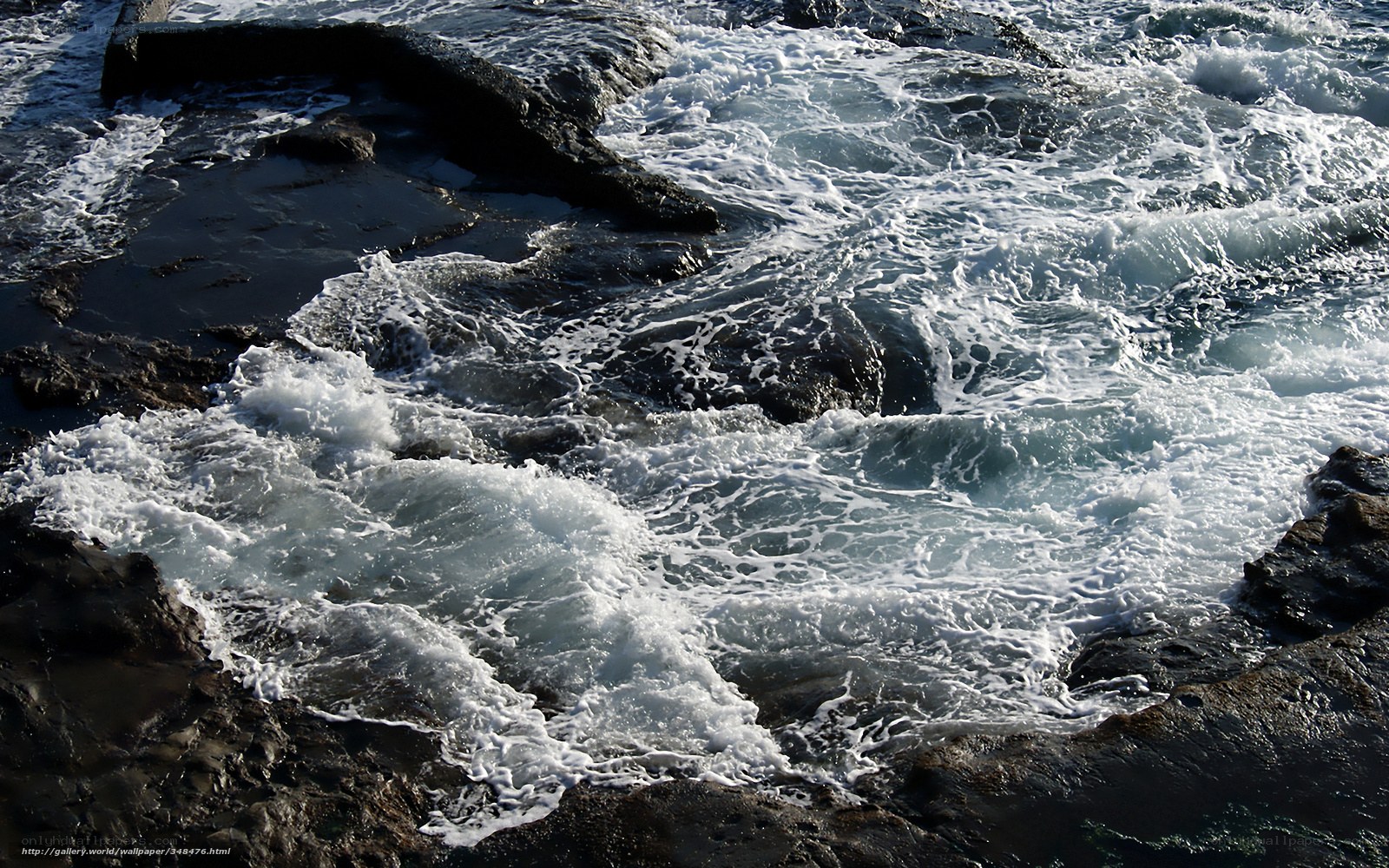 Waves crashing on rocky shore