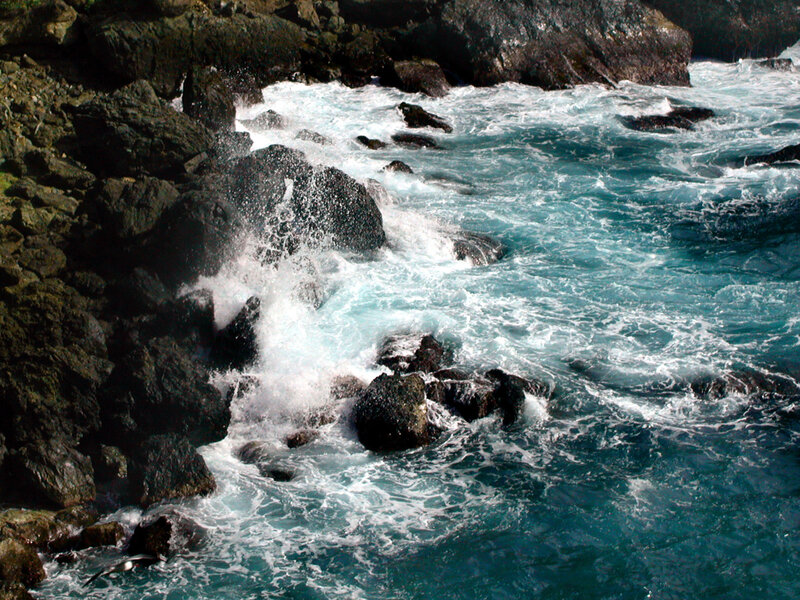 Waves crashing on rocky shore
