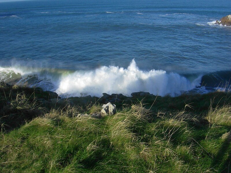 Waves crashing on rocky shore