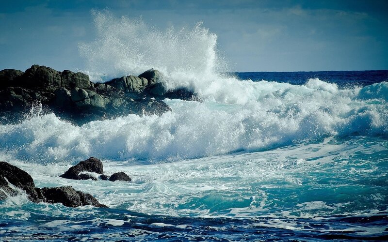 Waves crashing on rocky shore