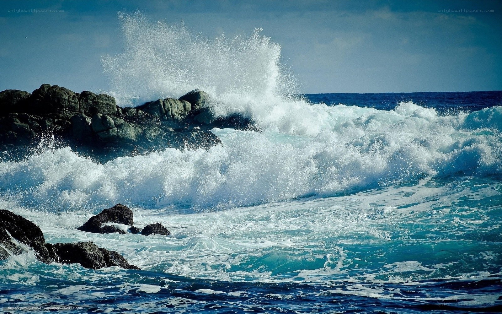 Waves crashing on rocky shore