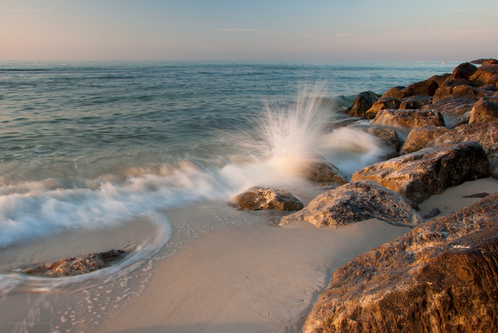 Waves crashing on rocky shore