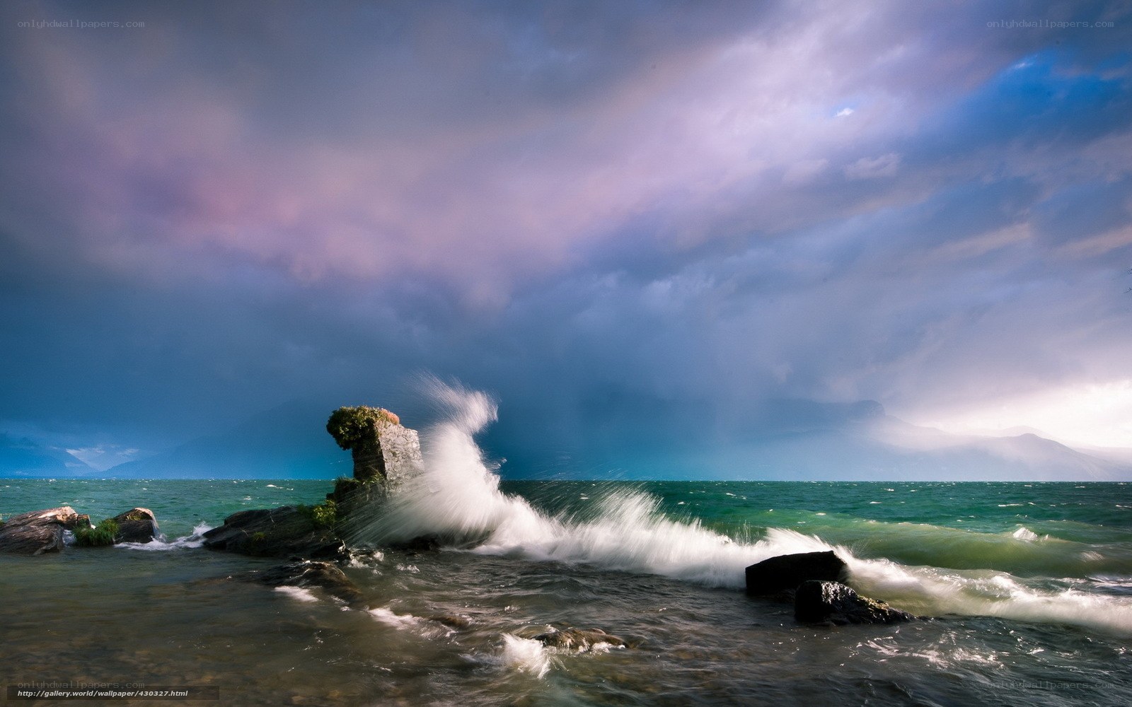 Waves crashing on rocky shore