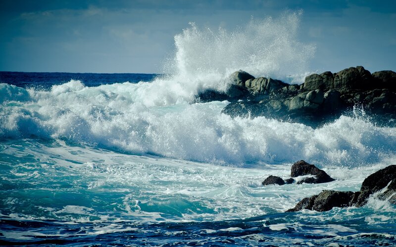 Waves crashing on rocky shore