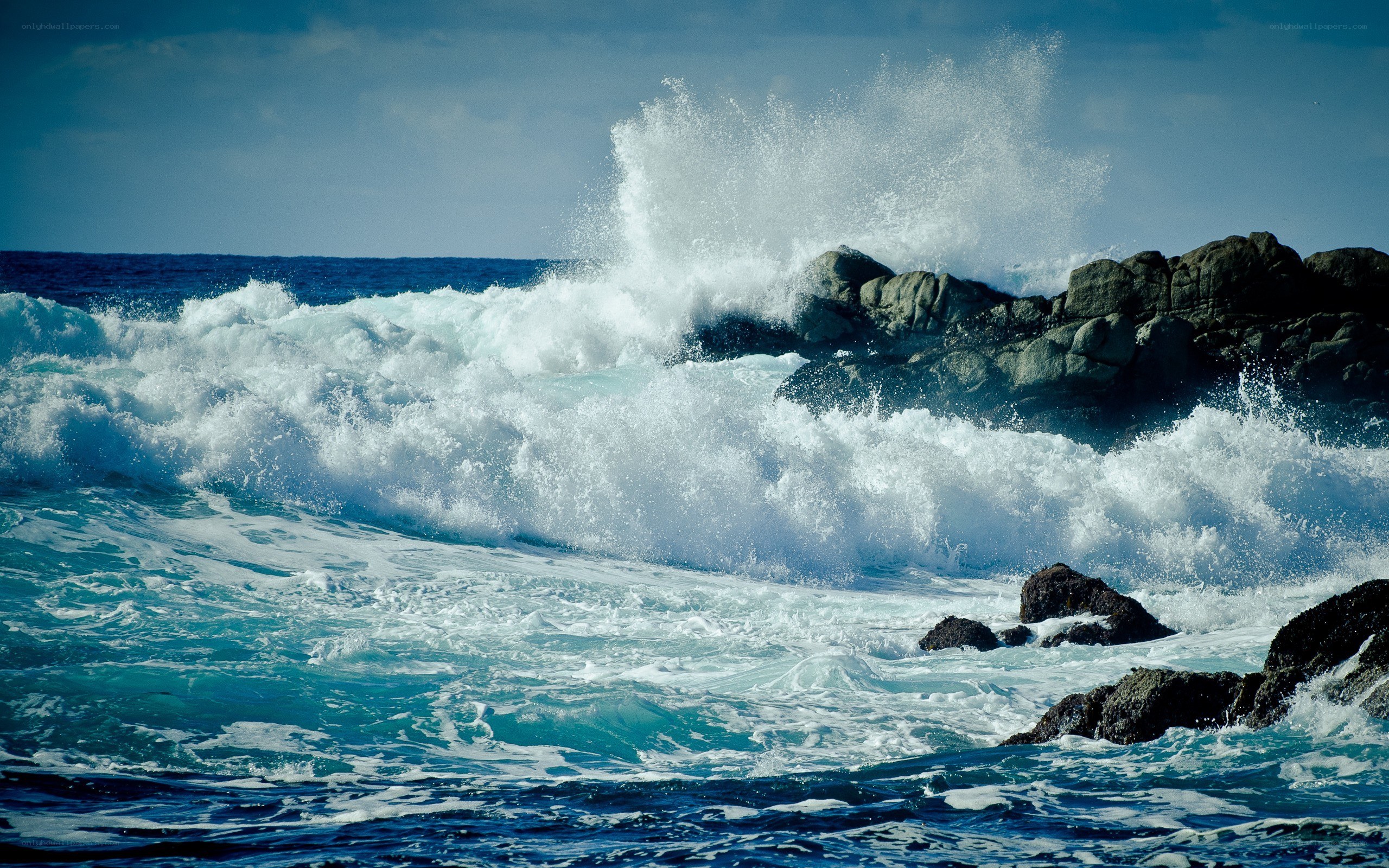 Waves crashing on rocky shore