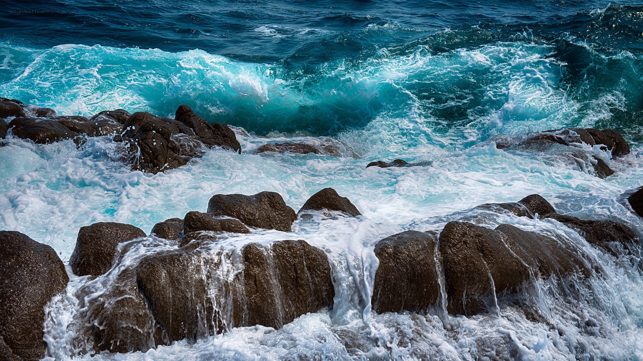Waves crashing on rocky shore