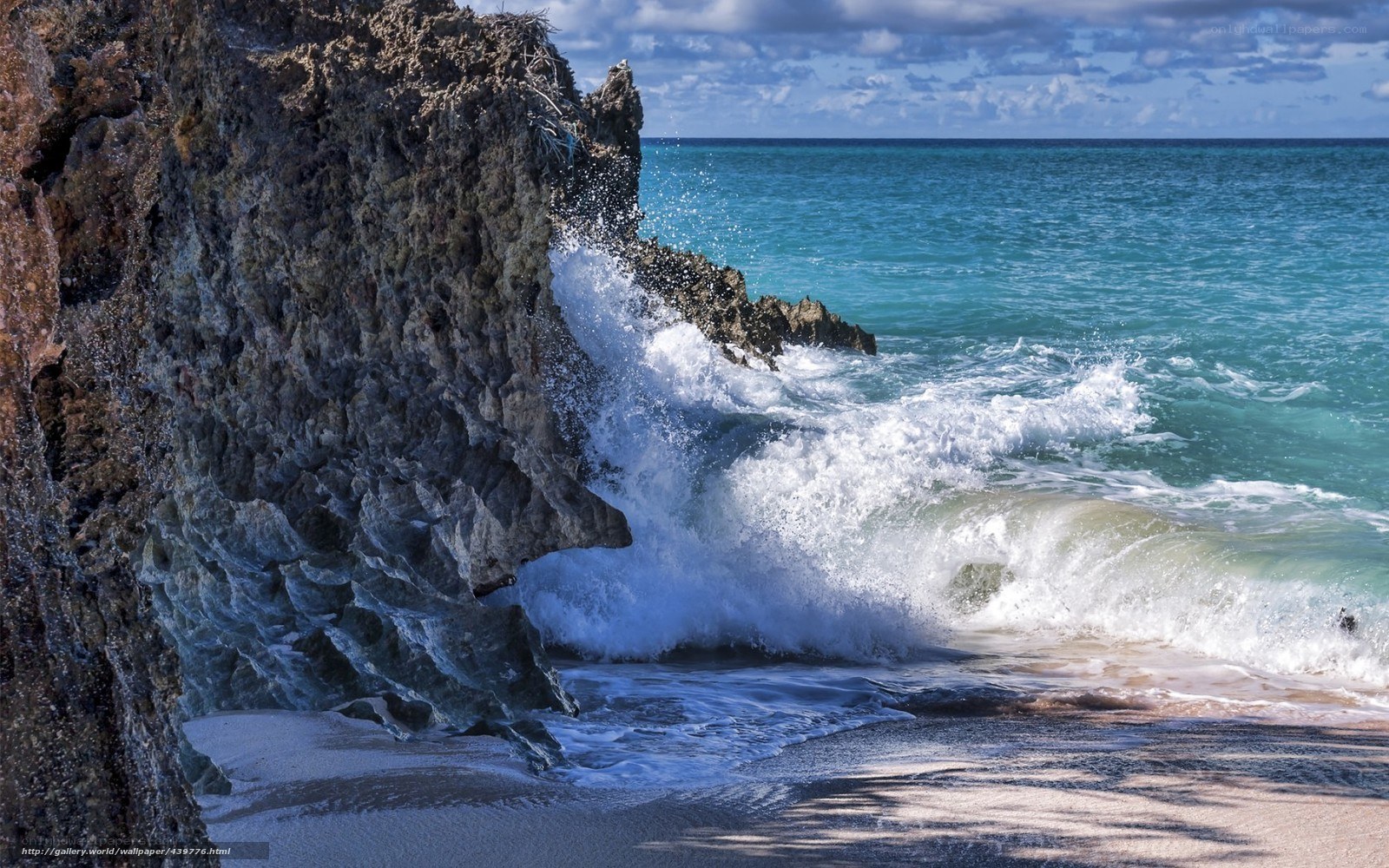 Waves crashing on rocky shore