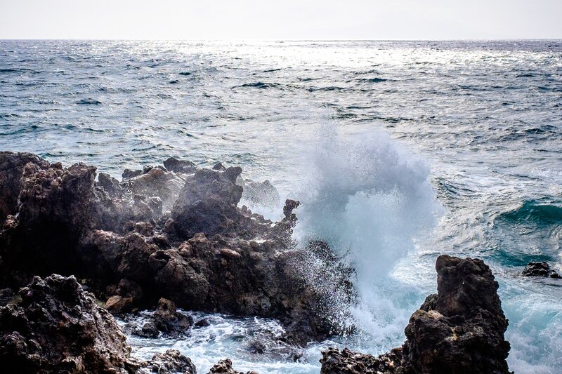 Waves crashing on rocky shore