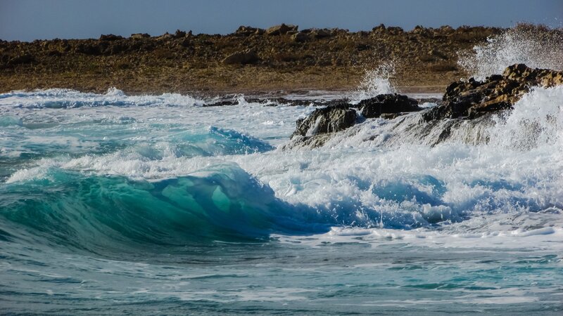 Waves crashing on rocky shore