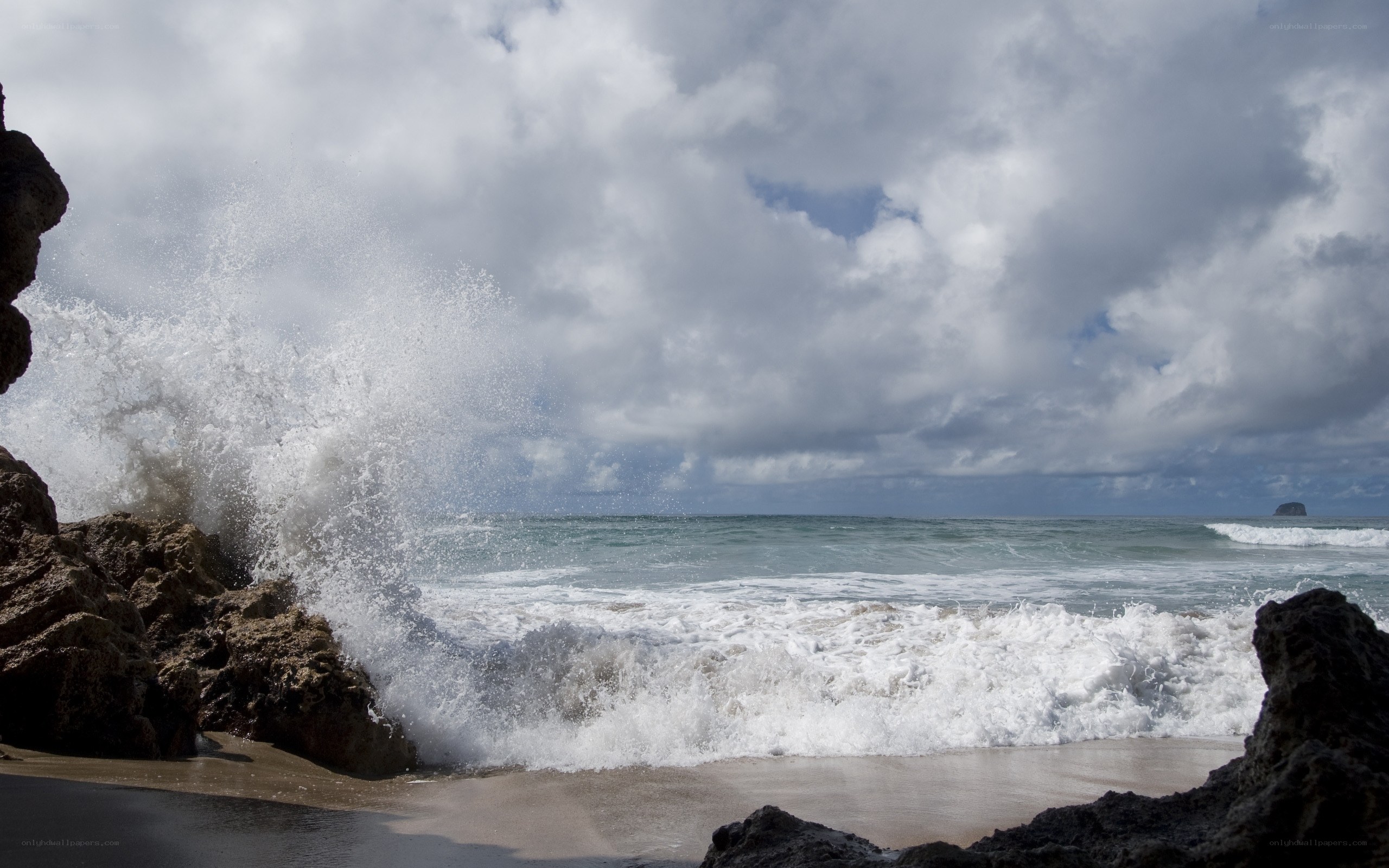 Waves crashing on rocky shore