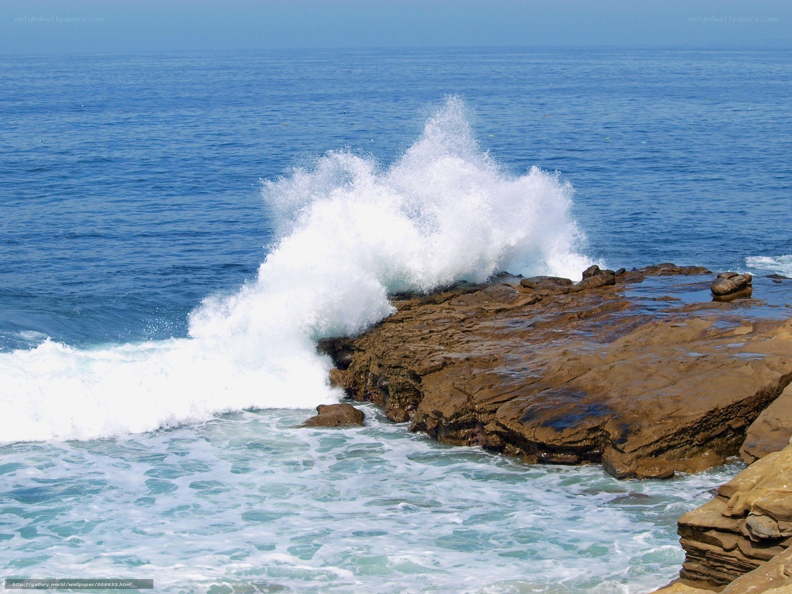 Waves crashing on rocky shore