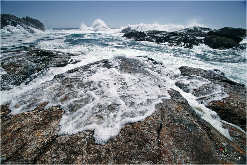 Waves crashing on rocky shore