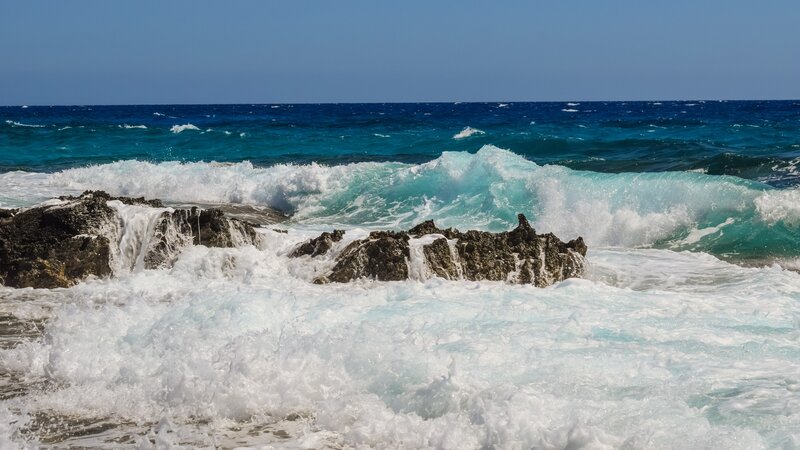 Waves crashing on rocky shore