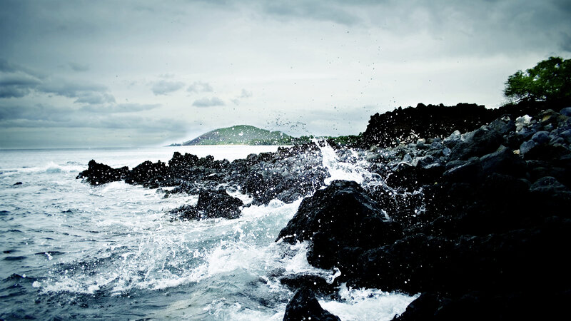 Waves crashing on rocky shore
