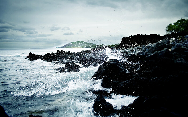 Waves crashing on rocky shore