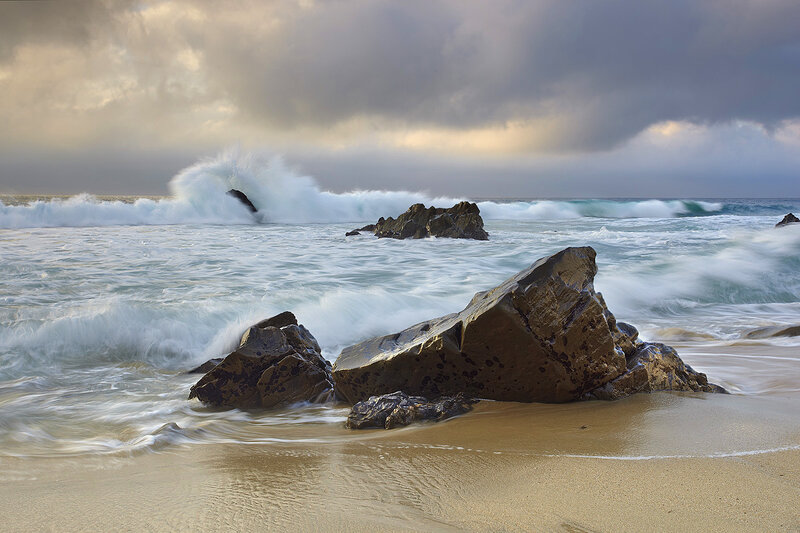 Waves crashing on rocky shore