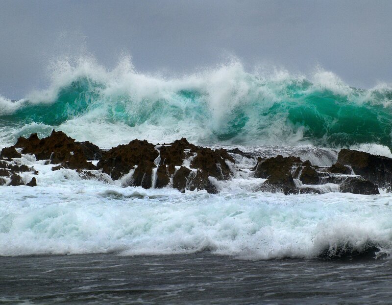 Waves crashing on rocky shore